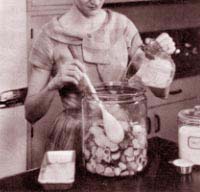Photograph from the USDA Home and Garden Bulletin No. 92 of a woman making pickles